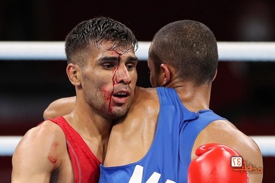 عکس + المپیک ۲۰۲۰ توکیو، دانیال شه بخش بوکسور ایران با صورت خونی پیروز شد